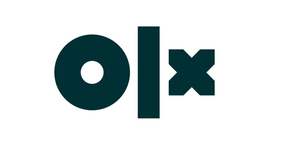 Oszustwo na OLX. Logo OLX w kolorze zielonym na białym tle.