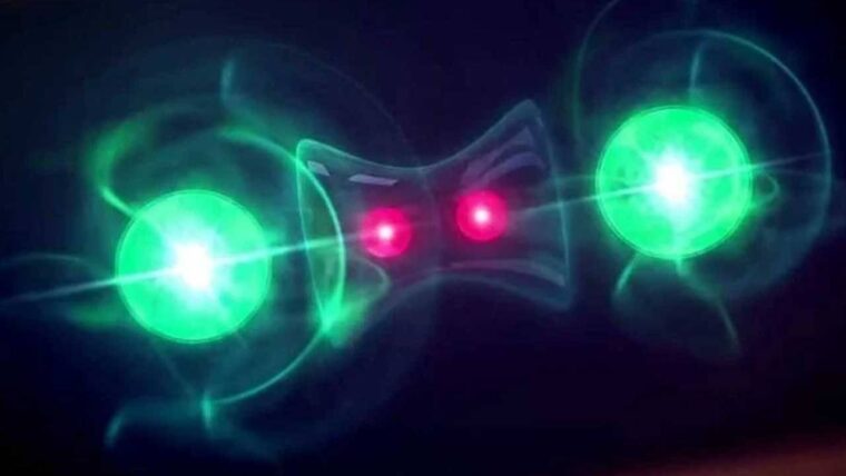 Ilustracja przedstawiająca zjawisko fizyczne z dwoma jasnozielonymi kulami emanującymi falami oraz połączonymi ciemnoniebieską strukturą z dwoma czerwonymi punktami w centrum. Symbolizuje to baterie kwantowe i zjawiska w nich wystepujące