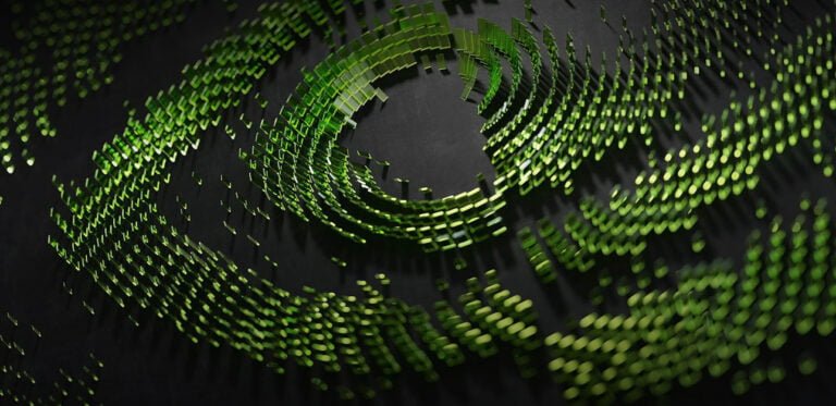 Obraz cyfrowy przedstawiający abstrakcyjną, wirującą formę złożoną z wielu zielonych, świecących prostokątów rozrzuconych na ciemnym tle, tworzących efekt trójwymiarowej spirali.