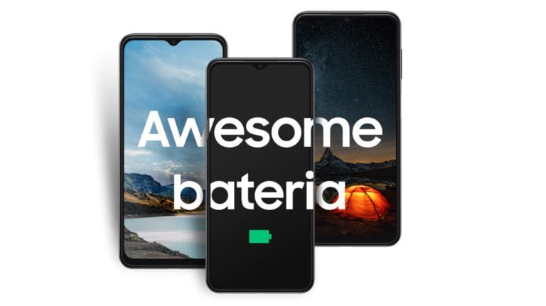 Trzy smartfony Samsung Galaxy A13 ustawione obok siebie na białym tle; środkowy z napisem "Awesome bateria" na wyłączonym ekranie i ikoną naładowanej baterii, pozostałe dwa z krajobrazami na ekranach.