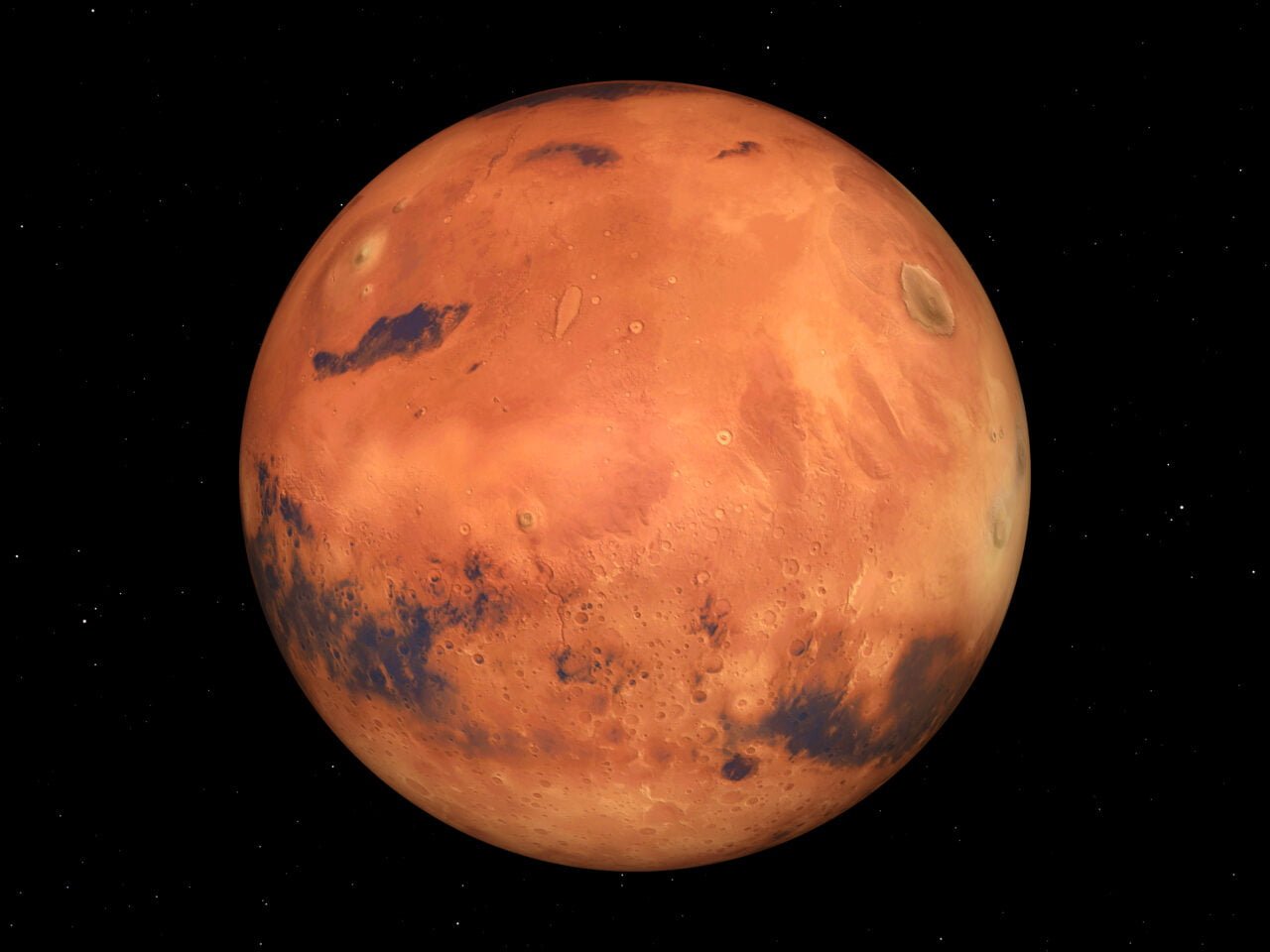 Zdjęcie planety Mars na tle gwiaździstego nieba. Ilustracja do teksu opisującego lot na Marsa dla nowych astronautów NASA.