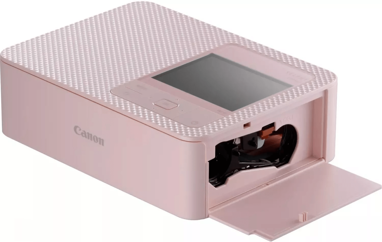 Różowa drukarka fotograficzna Canon z otwartym przedziałem na papier.