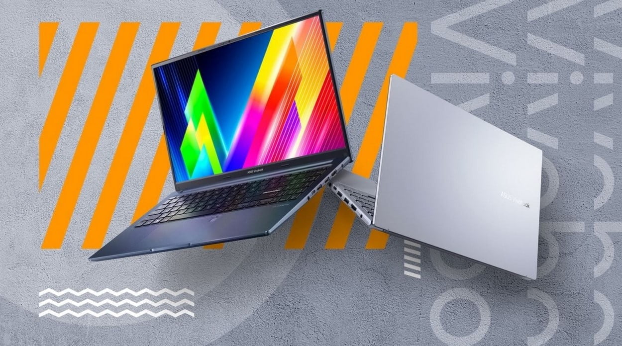Jeden z polecanych laptopów do 4000 zł. Asus Vivobook na szaro-pomarańczowym tle