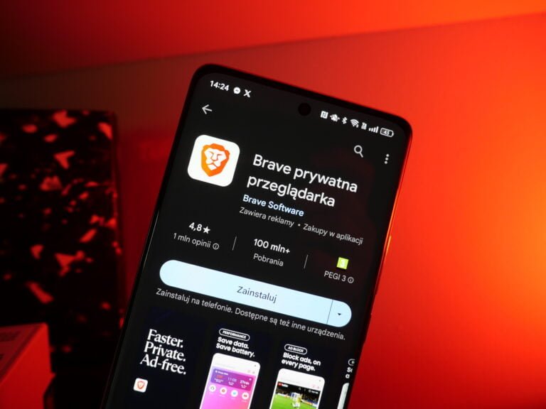 Smartfon wyświetlający stronę aplikacji przeglądarki Brave w sklepie z aplikacjami na czerwonym tle.
