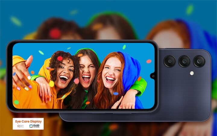 Drei lächelnde junge Frauen in bunten Sweatshirts feiern und werfen buntes Konfetti, angezeigt auf dem Smartphone mit Bildunterschrift "Augenpflege-Display OLED" befindet sich unterhalb des Bildschirms.