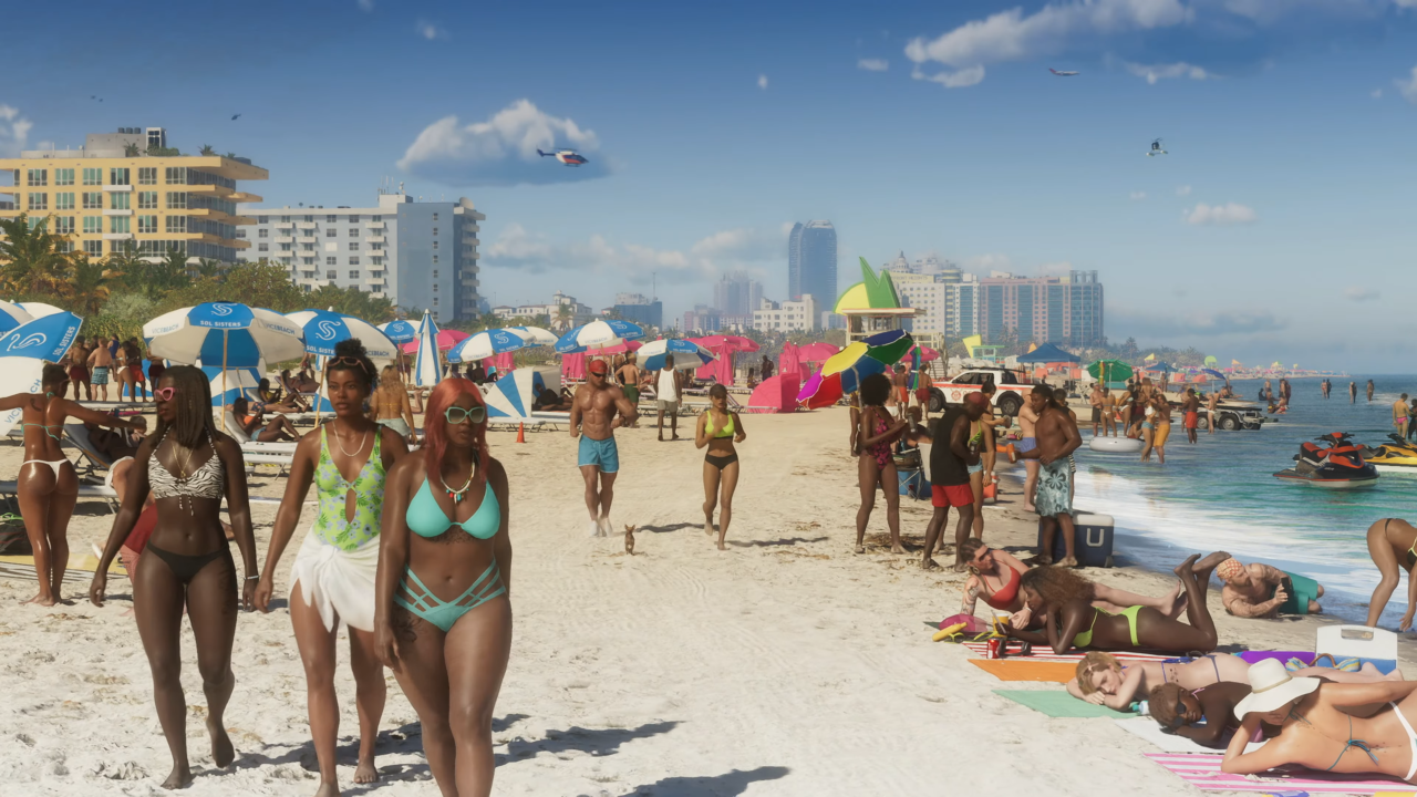 Zatłoczona plaża Vice City z GTA 6 VI z licznymi osobami w strojach kąpielowych odpoczywającymi na leżakach pod kolorowymi parasolami, w tle widoczne zabudowania miasta i niebieskie niebo z kilkoma latającymi helikopterami.