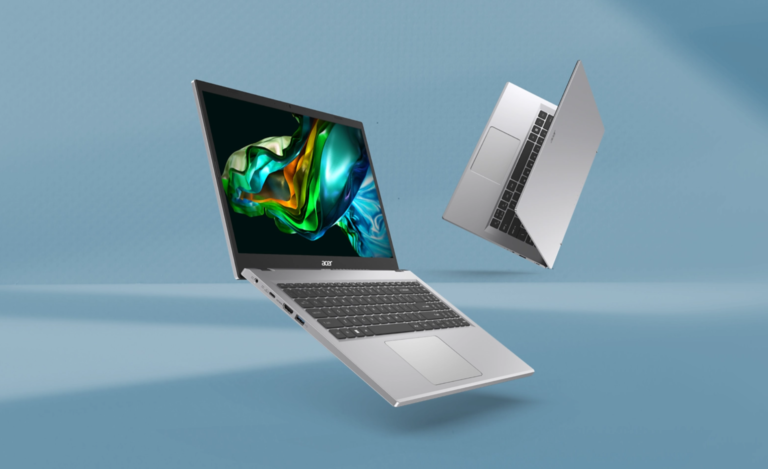 Dwa laptopy Acer na niebieskim tle, jeden otwarty i postawiony na pionowej krawędzi, a drugi unosi się w powietrzu z ekranem pokazującym kolorowy wygaszacz ekranu.