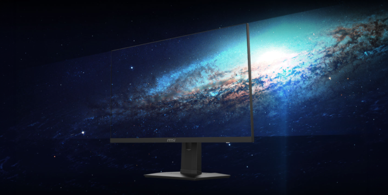 Nowoczesny monitor MSI z wyświetlanym graficznym obrazem kosmosu, prezentujący gwiazdy i galaktykę, umieszczony na ciemnym tle.