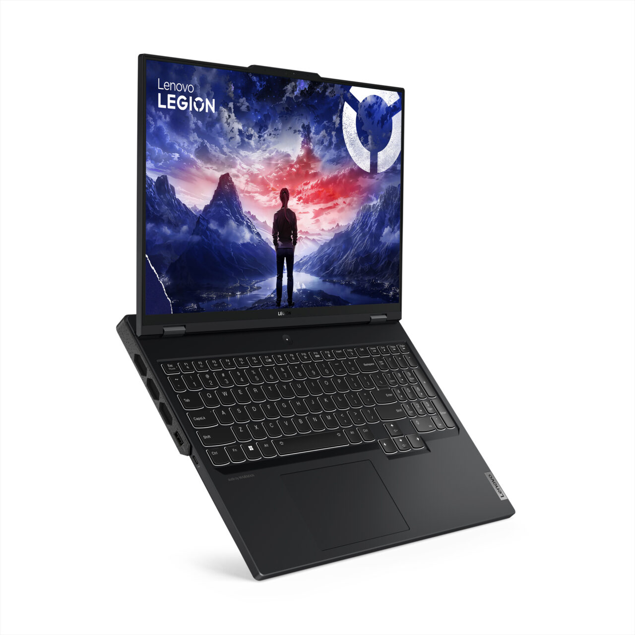 Laptop Lenovo Legion otwarty z grafiką przedstawiającą postać ludzką stojącą na tle górskiego krajobrazu i zachodzącego słońca na ekranie.