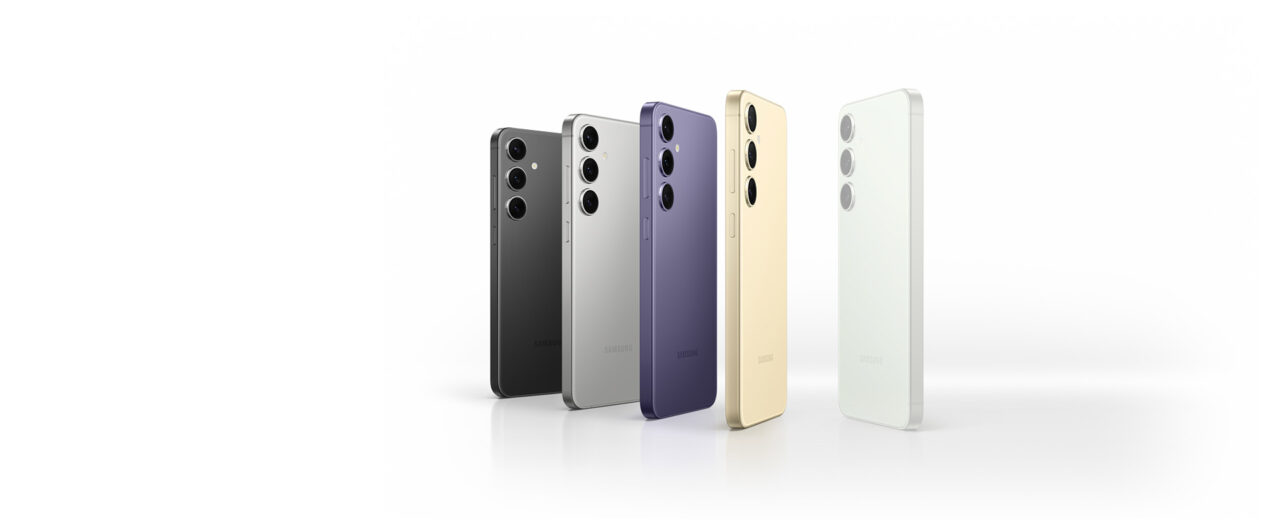 Pięć smartfonów Samsung Galaxy S24 ustawionych pionowo obok siebie na białym tle, prezentujących różne kolory i konfiguracje aparatu.