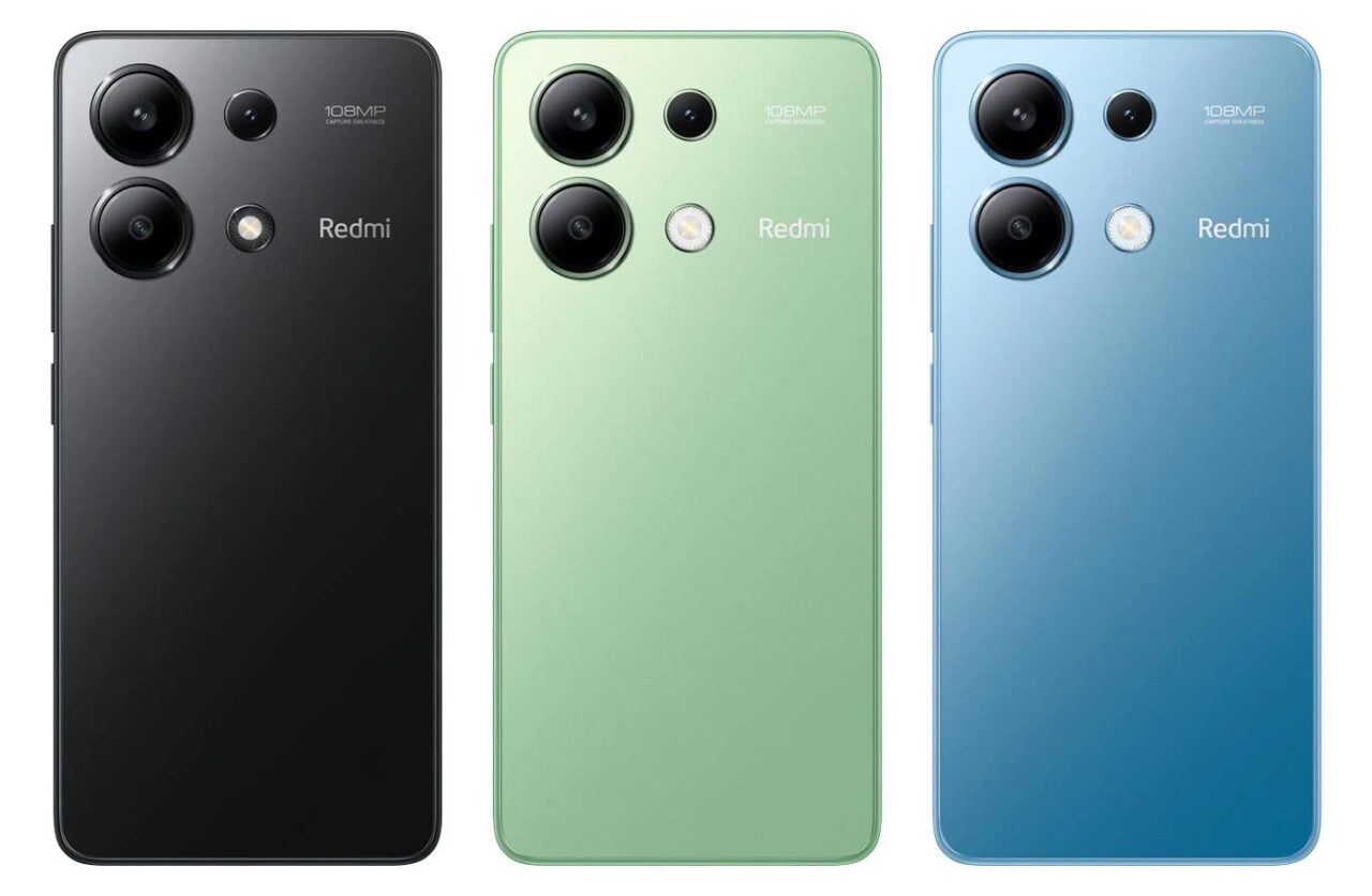 Trzy smartfony xiaomi na raty 0%, modele Redmi w kolorach czarnym, zielonym i niebieskim, widoczny tylny panel każdego z nich z układem czterech aparatów i logo marki.