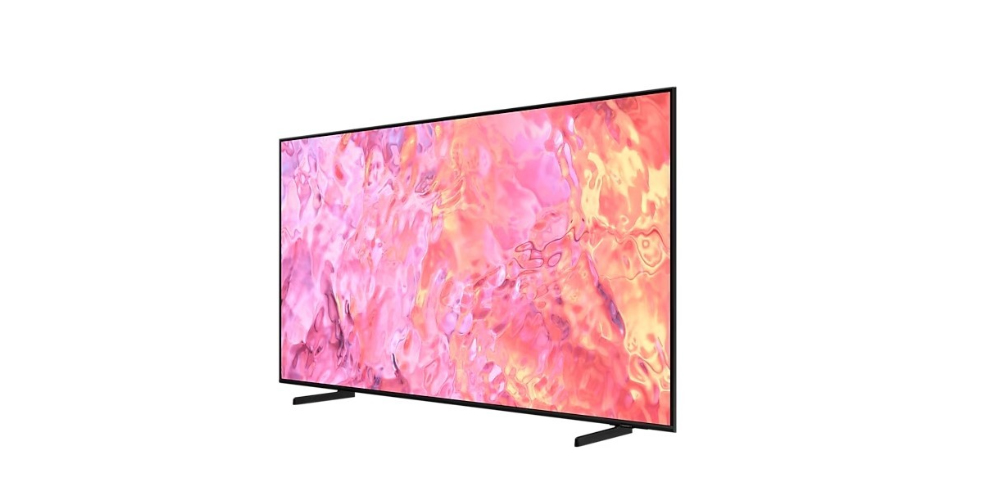 Nowoczesny telewizor Samsung z płaskim ekranem wyświetlający abstrakcyjną grafikę w odcieniach różu i pomarańczu.