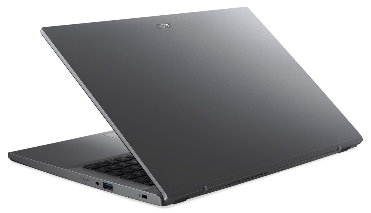 Tylna część zamkniętego, szarego laptopa marki Acer z widocznymi portami po lewej stronie.