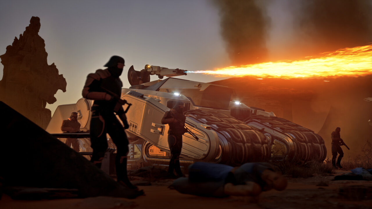 Scena przedstawia sci-fi z żołnierzami w futurystycznych zbrojach koło pojazdu przypominającego czołg, w tle zachód słońca na pustyni oraz dym wznoszący się w powietrzu.