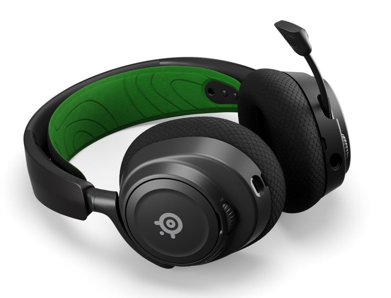 Słuchawki nauszne z mikrofonem na elastycznym ramieniu, czarne z zielonymi akcentami w środku pałąka.