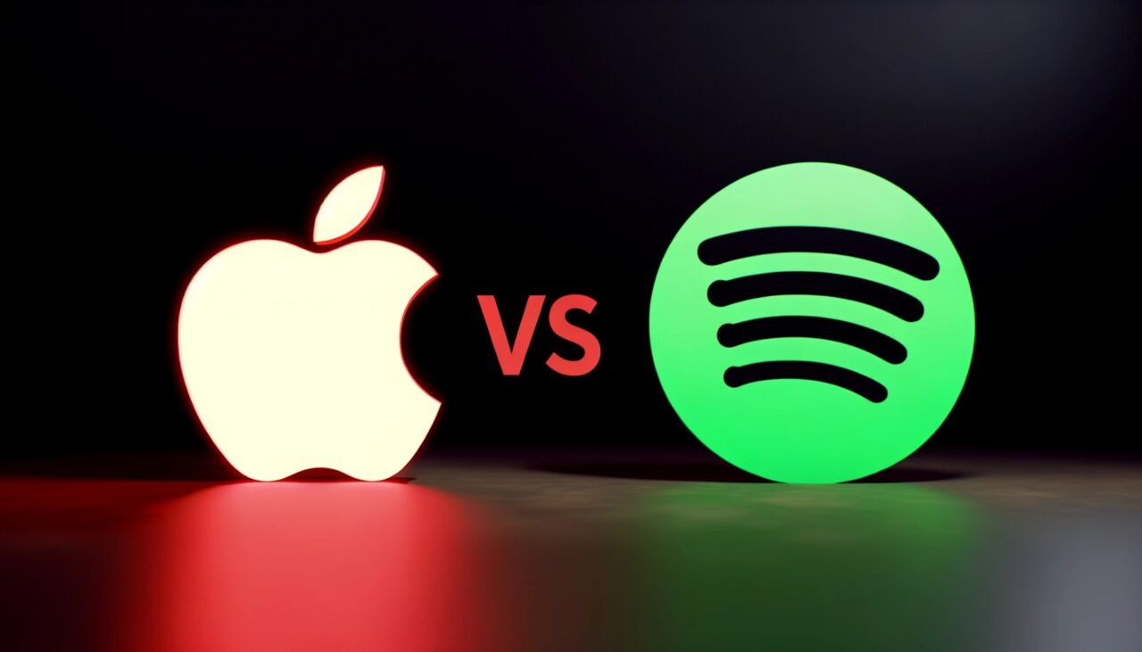 Grafika przedstawiająca porównanie Apple Music i Spotify, z logo Apple w czerwonym kolorze po lewej stronie i logo Spotify w zielonym kolorze po prawej, oba na ciemnym tle z napisem "VS" pomiędzy nimi.