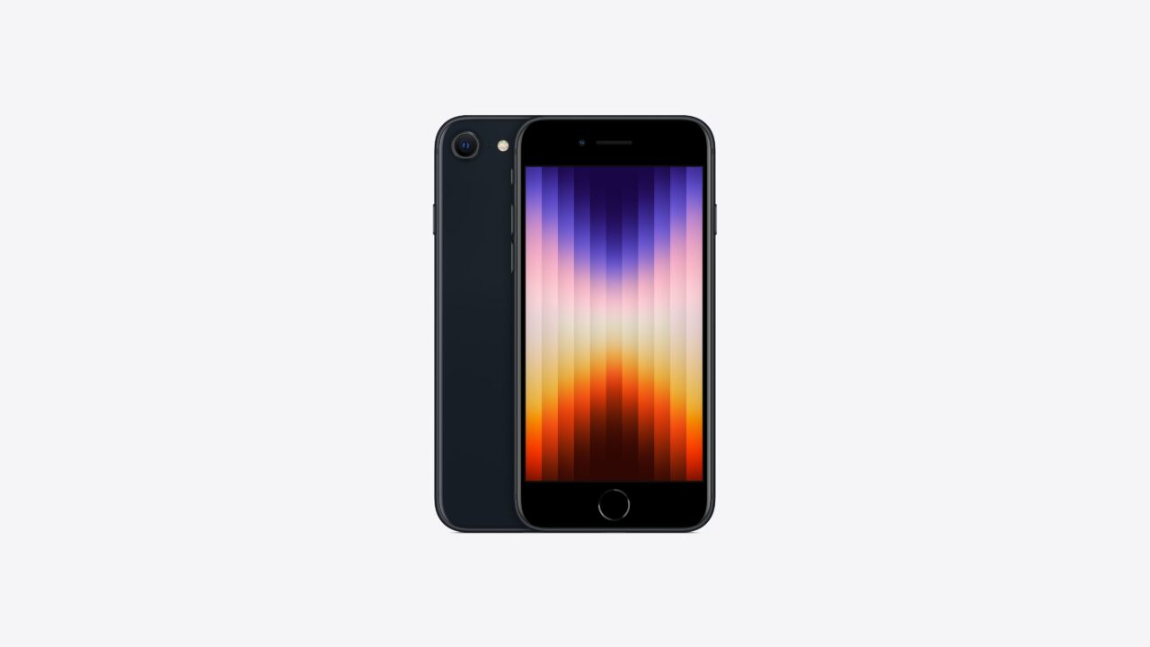Smartphone preto com painel frontal exibindo um gradiente colorido de roxo a laranja em um fundo branco.