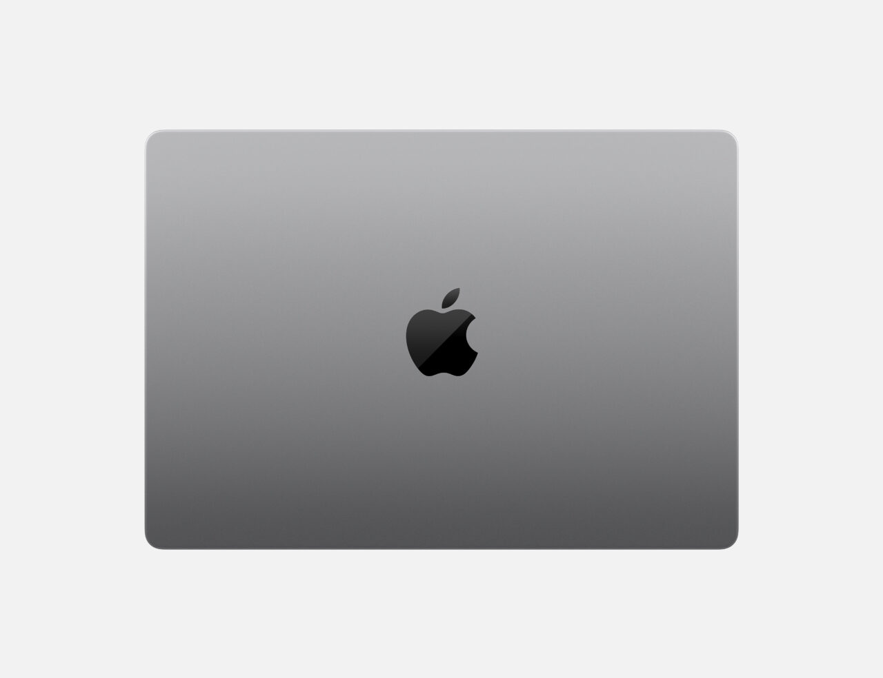 Górna część szarego laptopa Apple z widocznym logo firmy.