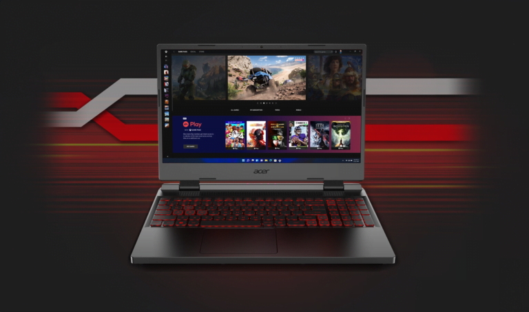 Laptop gamingowy Acer z czerwonym podświetleniem klawiatury wyświetlający interfejs platformy do dystrybucji gier cyfrowych z miniaturkami gier na ekranie, umieszczony na tle w odcieniach czerwieni i czerni.