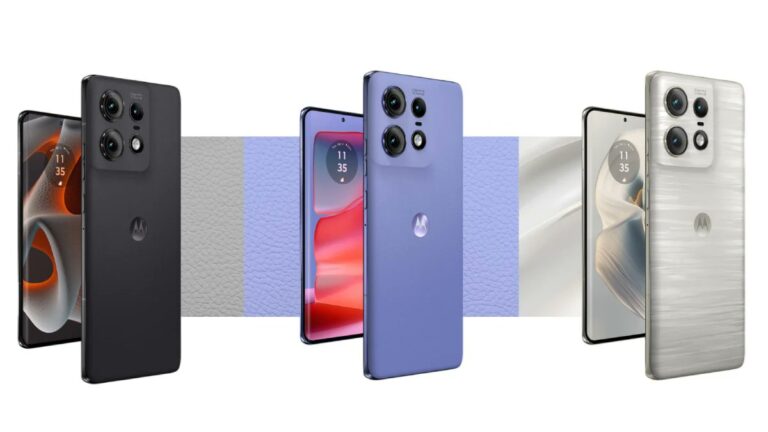 Trzy smartfony Motorola różnych kolorów, widoczne z przodu i tyłu, z akcentami tekstury skóry w tle.