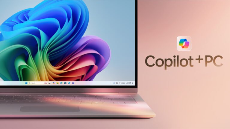Laptop z kolorowym abstrakcyjnym tłem na ekranie oraz napisem "Copilot+PC" po prawej stronie.