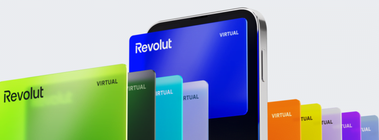 Karty wirtualne Revolut w różnych kolorach na tle smartfona.