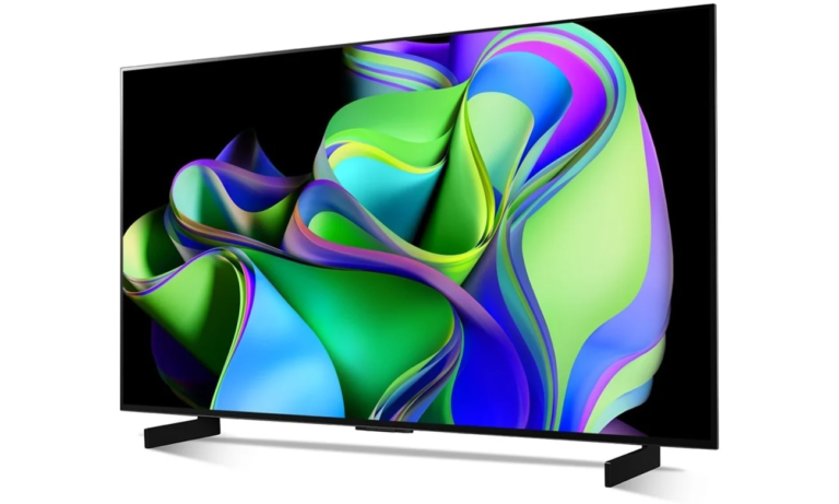 Czarny telewizor ze kolorowym ekranem na podstawce