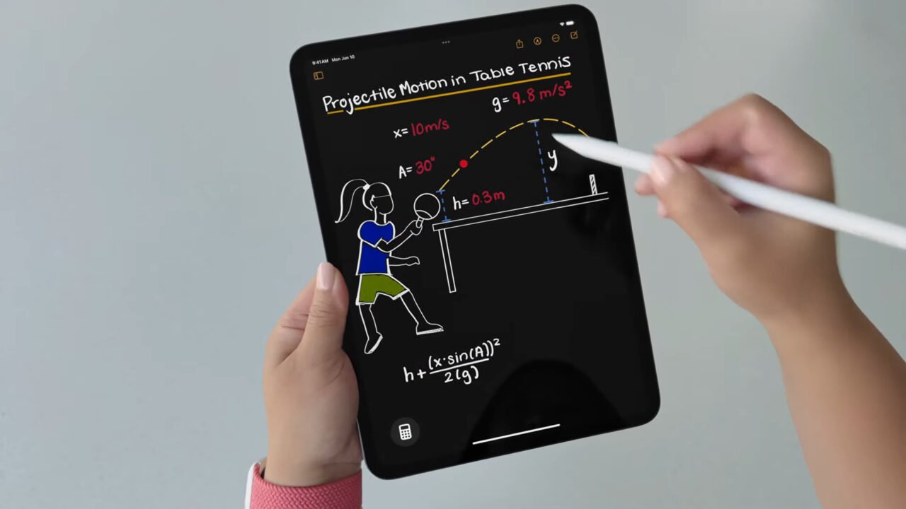 Tablet trzymany w rękach, na ekranie rysunek przedstawiający ruch pogrążony w tenisie stołowym z notatkami i równaniami matematycznymi.