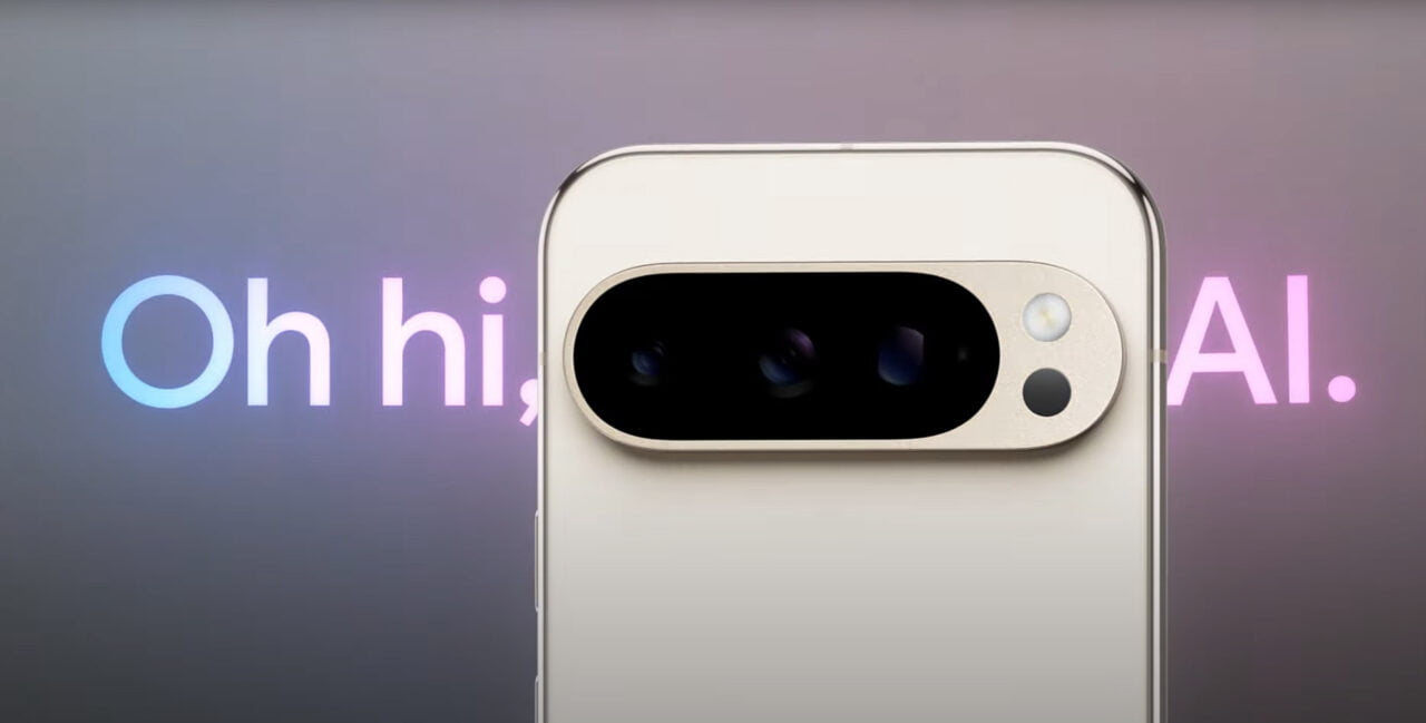 Aparat fotograficzny smartfona Google Pixel 9 Pro na tle napisu "Oh hi, AI". Screen z oficjalnego wideo firmy.