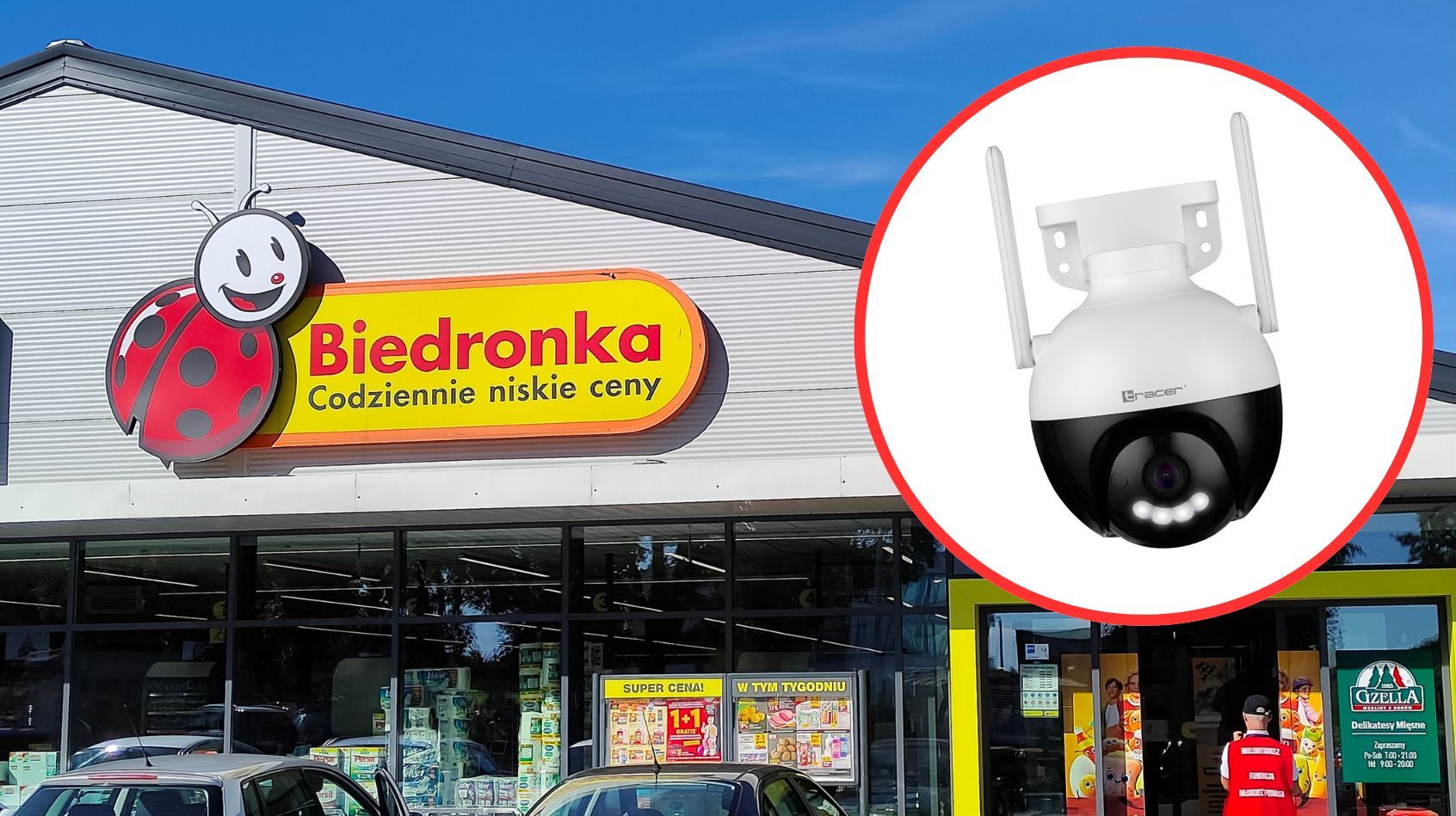 Sklep Biedronka z logo i hasłem "Codziennie niskie ceny" na fasadzie, obok okrągłego zdjęcia kamery monitorującej.