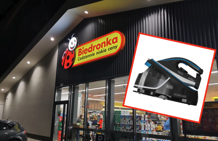 Sklep Biedronka z wywieszką „Codziennie niskie ceny” i zdjęciem odkurzacza BLACK+DECKER.